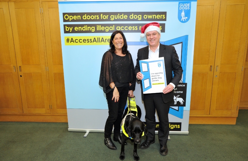 Henry Smith MP helps Open Doors for Guide Dog Owners this Christmas