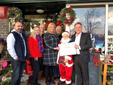 Henry Smith MP congratulates Festive Crawley Christmas Shop Window Winner
